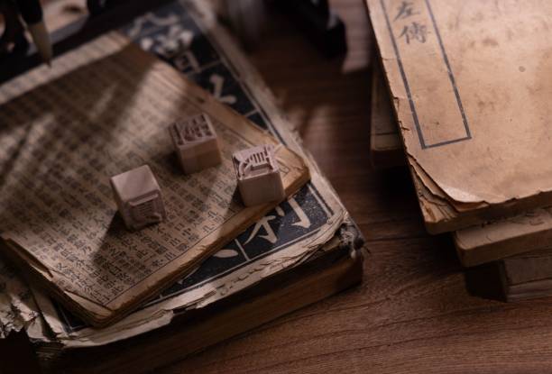 istock Closeup of ancient thread-bound books with Chinese characters, movable type printing. 1552602622