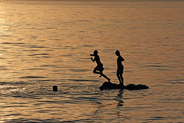 istock jumpin into the water 155260555