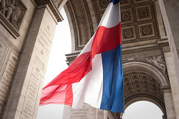 istock Red white and blue flag waving under a big arch 155260787