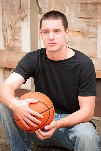 istock young man with basketball 155261520