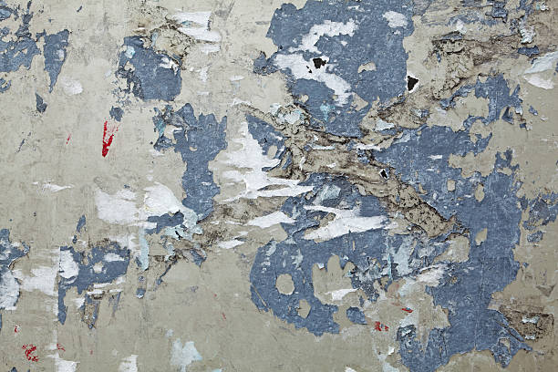 istock XXXL Full Frame Cracked Cement Covered Torn Paper Scraps Background 155261682