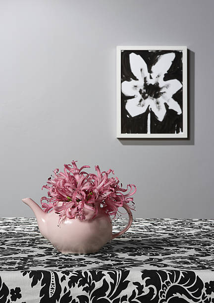 Pink tea pot vase with flower drawing stock photo