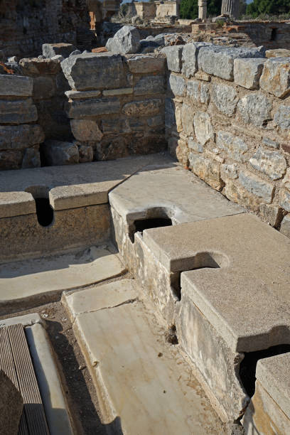 exterior architecture and ruins design at ephesus archaeological museum with old toilet bowl - toilet public restroom ephesus history imagens e fotografias de stock