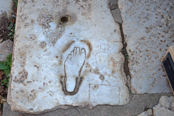 istock Exterior architecture and ruins design at Ephesus Archaeological Museum with old footprints 1552625397