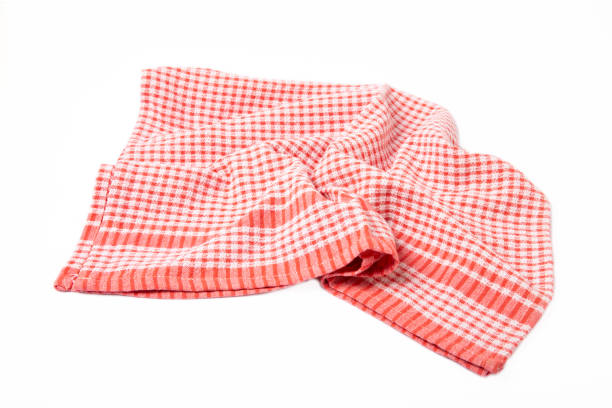 Kitchen towel .Cotton napkin isolated on white background. Picnic towel. Home textiles. Folded cloth.Food serving design element. Square napkin.