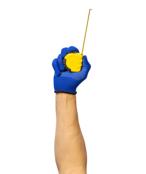 istock Electrician. Electrician's hand with tools isolated on white background. Electrician's tool. workforce. measuring tape in hands. 1552644835