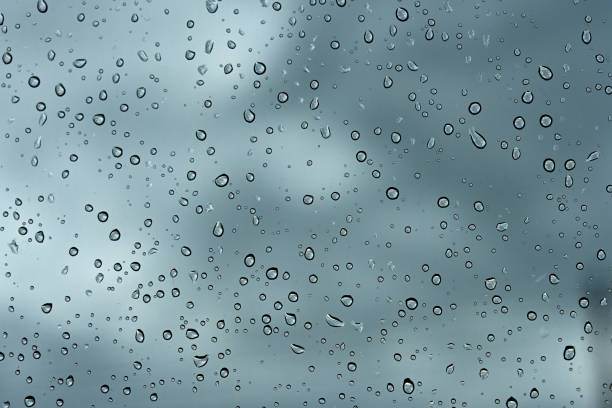 istock raindrops drops on car glass sky background 1552646969