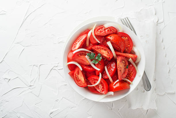 istock Tomato salad with onion and parsley 1552647526
