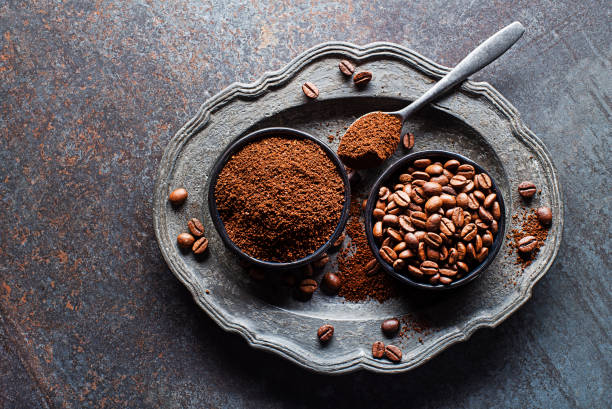 istock Freshly roasted Coffee beans and ground coffee powder 1552647543