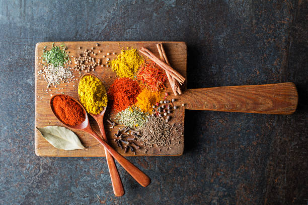Cooking dishes with colorful herbs and spices