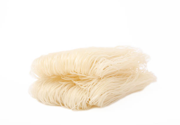 istock Dried raw rice noodles isolated on white background. 1552650758