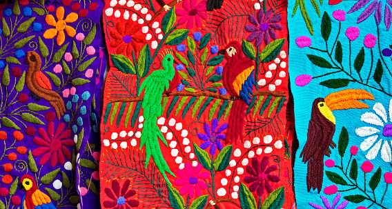 Traditional, multicolored, vibrant, bird patterned, handicraft Mexican textile for sale made from the people of Mayan-Tzotziles indigenous communities, Chiapas state, Mexico