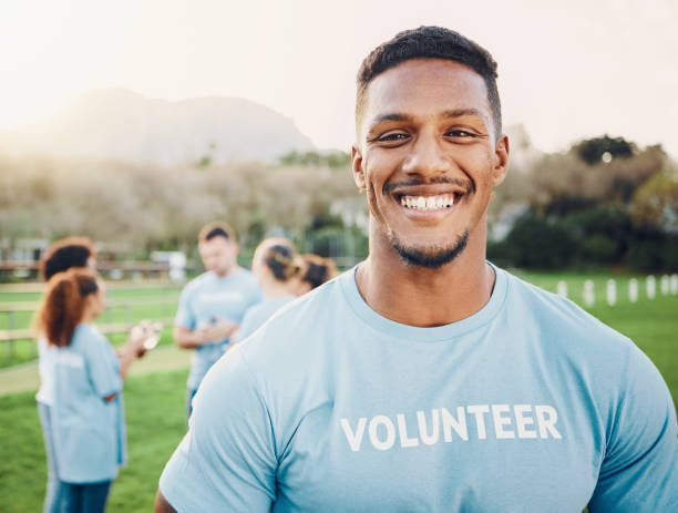 istock Man in portrait, volunteer and smile with eco friendly help, environment and sustainability, green and waste management. Cleaning, charity and team leader with happiness and community service 1552696082