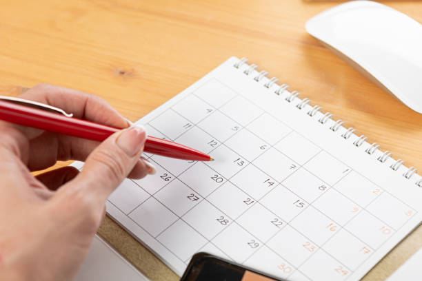 istock Planner plan Schedule Calendar and agenda reminders, work from home online. desktop calendar with stationery and pen pencil, keyboard for plan daily meeting and note holiday trip in diary at office desk. 2023 calendar reminder concept. 1552696644