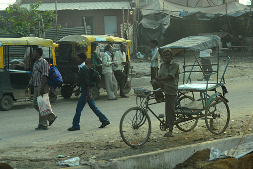 Bicycle Taxi waiting for customers on a sunny afternoon in the streets of New Delhi, India