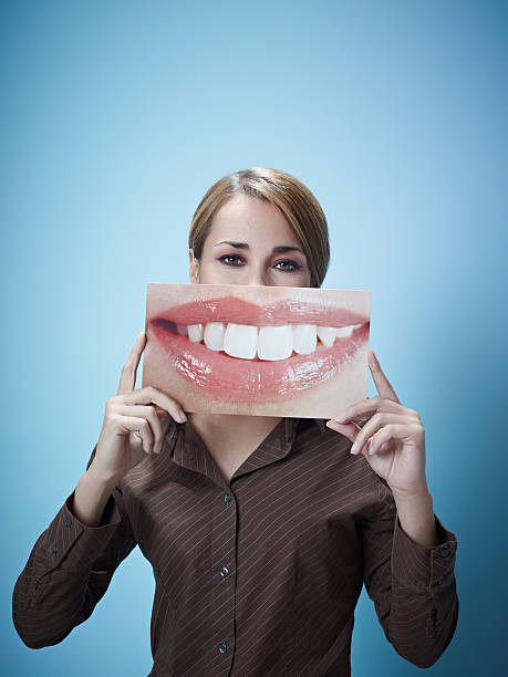 istock businesswoman with big mouth 155269822