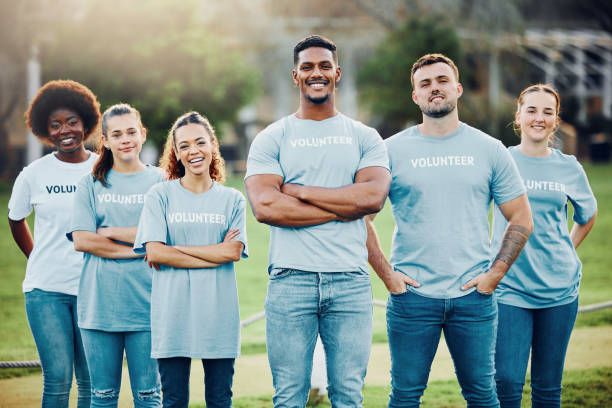istock Volunteer group, team and community service, eco friendly help with people in portrait, solidarity and sustainability, Green, environment and green, sustainable development and volunteering to clean 1552699431