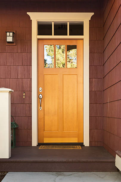 istock Light wood front door on a home 155270973