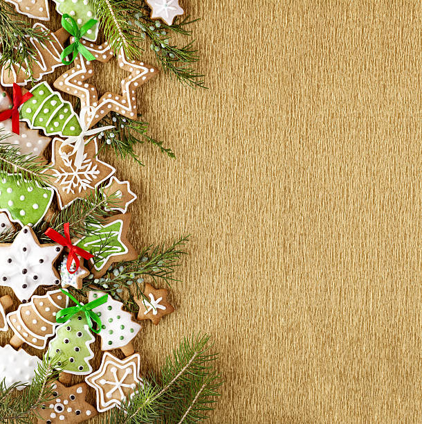 Christmas background. Ginger and Honey cookies on the gold paper.