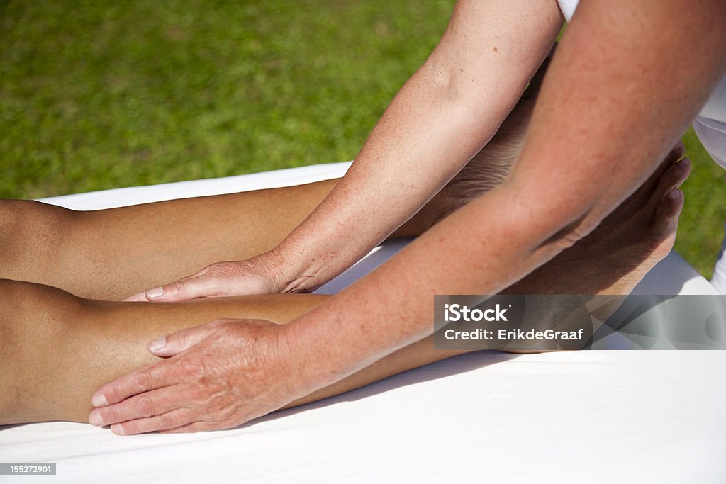 Polarity massage Polarity massage; a technique of gently rocking, holding and massaging to stimulate relaxation, restore energy flow and encourage revitalization Alternative Medicine Stock Photo