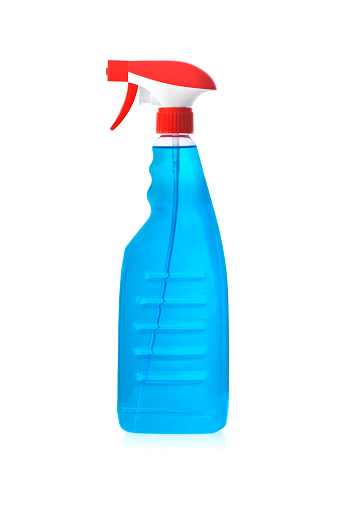 Window cleaning:  Spay bottle with clear blue cleaning liquid isolated against white background