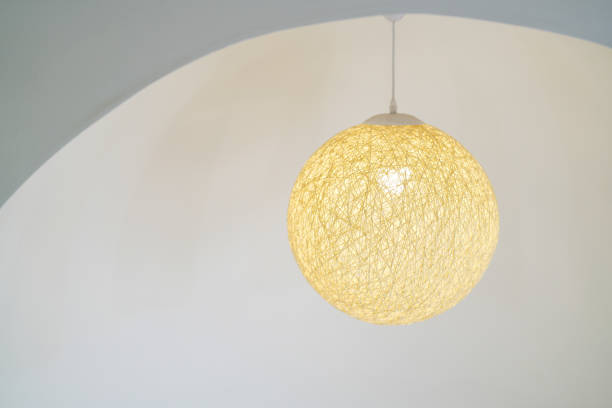 Round ceiling lamp made of thread on white background