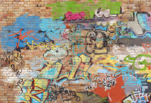 Graffiti on brick wall, composite of various images, layered and altered digitally so as to be non-identifiable.