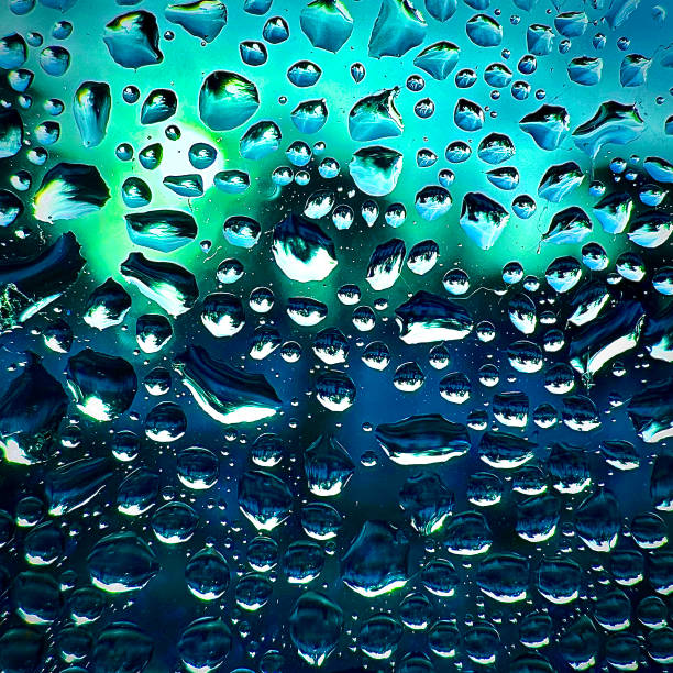 Raindrops on the window on a rainy day. stock photo