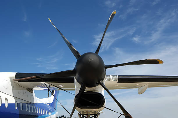 istock Small plane propeller closeup against blue sky 155276098