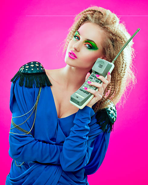 istock 80s style girl with vintage phone 155276290