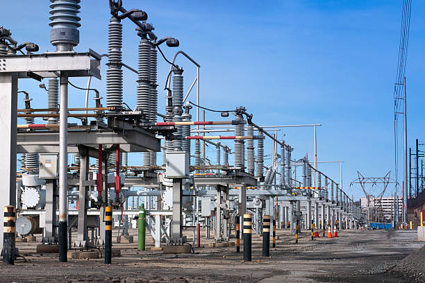 Electrical transmission substation An electrical transmission substation outside a cogeneration power plant. electricity substation photos stock pictures, royalty-free photos & images