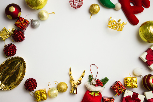 Christmas theme with red and golden ornaments and copy space.