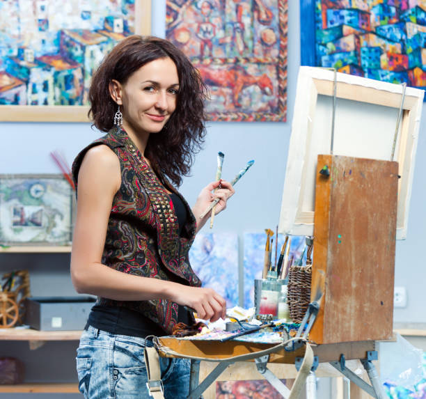 istock Artist painting in his studio 155277011