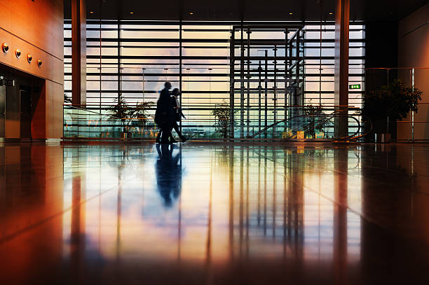 Airport passengers crowd walking blurred people