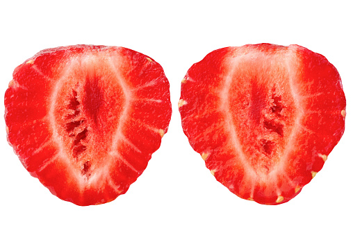 Two strawberry halves isolated on a white background.