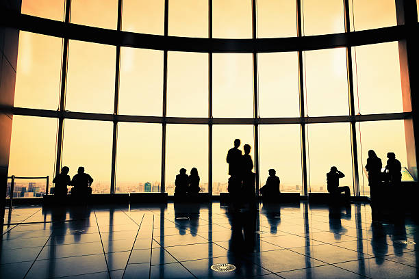 istock Backlit People Silhouettes Modern Architecture Glass Facade City Skyline 155277251