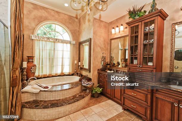 Luxury Master Bathroom With Custom Cabinet Work Beautiful Tub Stock Photo - Download Image Now