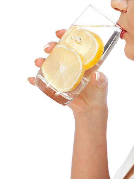 istock Woman drinking water with lemon 155277616