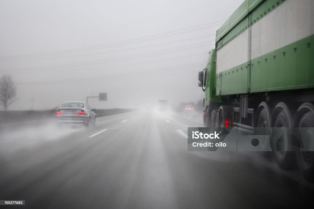 German Autobahn, bad weather conditions Highway on a rainy day, bad weather conditions - Photography has been taken during driving, some motion blur and water on the windshield Rain Stock Photo