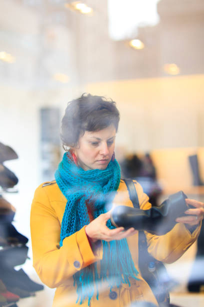 istock Young woman shopping for shoes 155277768