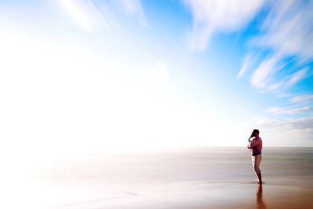istock Man with gas mask standing on the beach 155277868