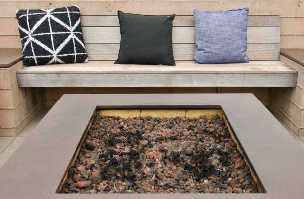 istock Outdoor fire pit lounge seating area with pillows 1552778918