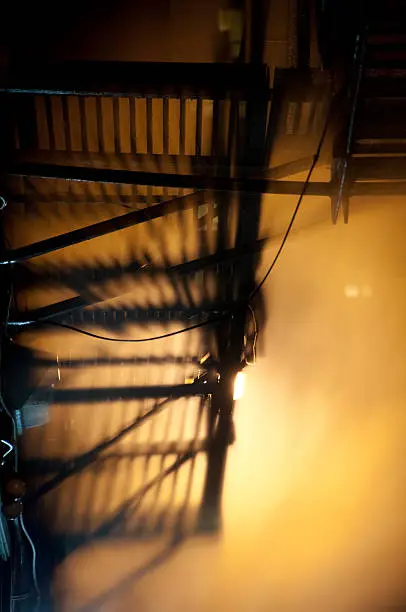 Photo of Smokey Chicago fire escape casting shadows