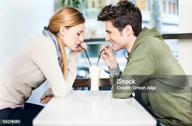 Couple Stock Photo - Download Image Now - Milkshake, Drinking Straw, Sharing