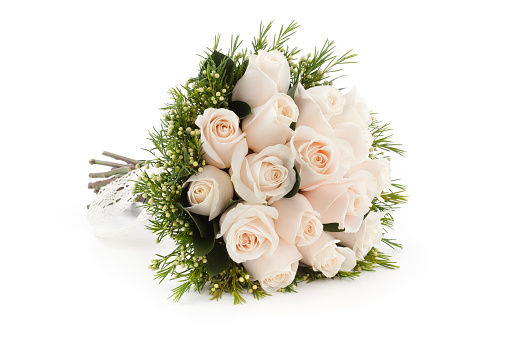 Small pink rose flowers and green leaves in a floral arrangement isolated on white