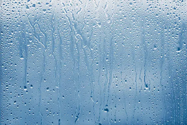 Condensation on glass window with water drops