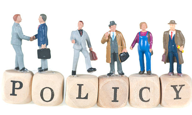 istock policy word with businessman 155278978