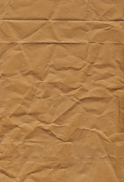 hi-res alten recycling brown kraft papiertüte faltig grunge-textur - impurities stock-fotos und bilder