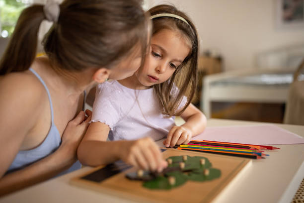 istock Mother and daughter playing with a puzzle together 1552790112