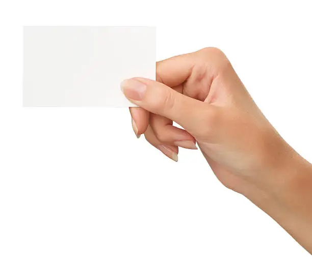 Close-up of an empty business card in a woman's hand isolated on white (+ Clipping path)